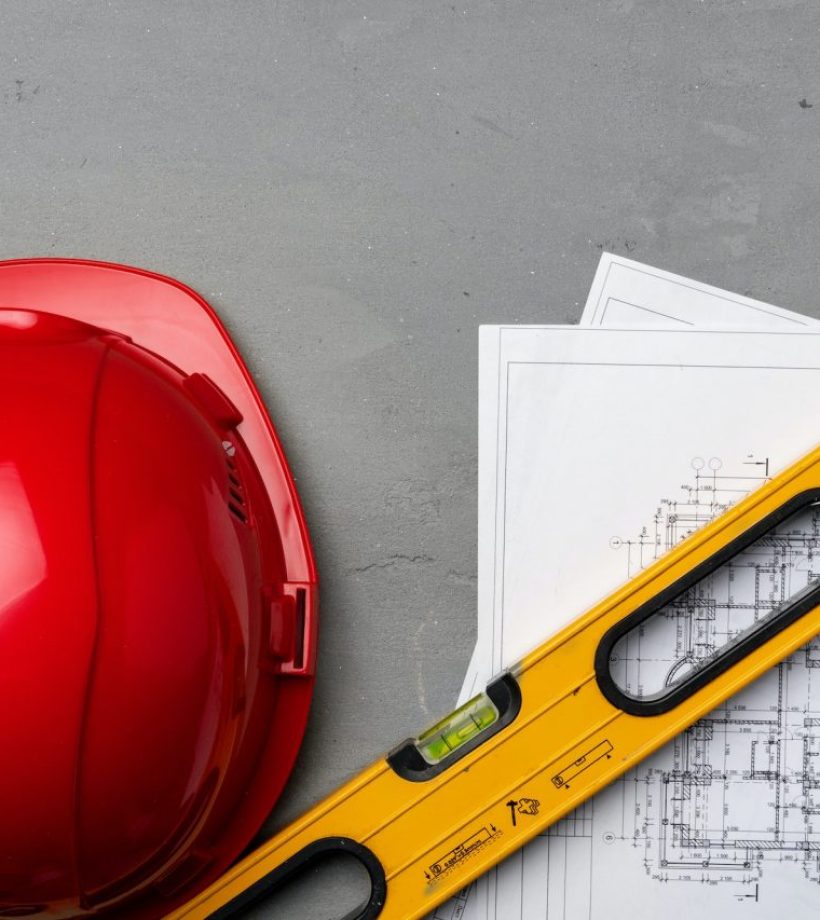 construction-worker-hardhat-blueprints-and-construction-level-top-view.jpg
